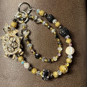 Gold and Black Turtle Bag Charm Bracelet